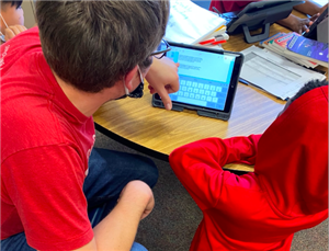 A teacher provides feedback to a student about this report on this iPad